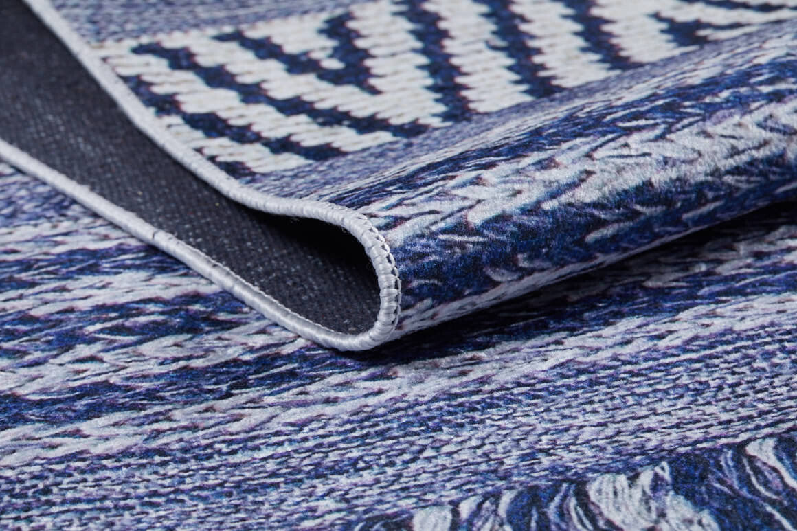 A close-up of the Wavy Wonders - Washable Rug - JR941 (Custom Size) shows its blue and white geometric weave, detailed texture, and precise edge stitching. Durable and stylish, this rug is ideal for high-traffic areas.