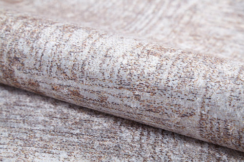 Load image 1 in gallery view. A close-up of the Wildflower Fields - Washable Rug - JR1632 (Custom Size) shows its light beige and brown mottled pattern, subtle woven texture, and a hint of metallic sheen in the flat weave fabric.