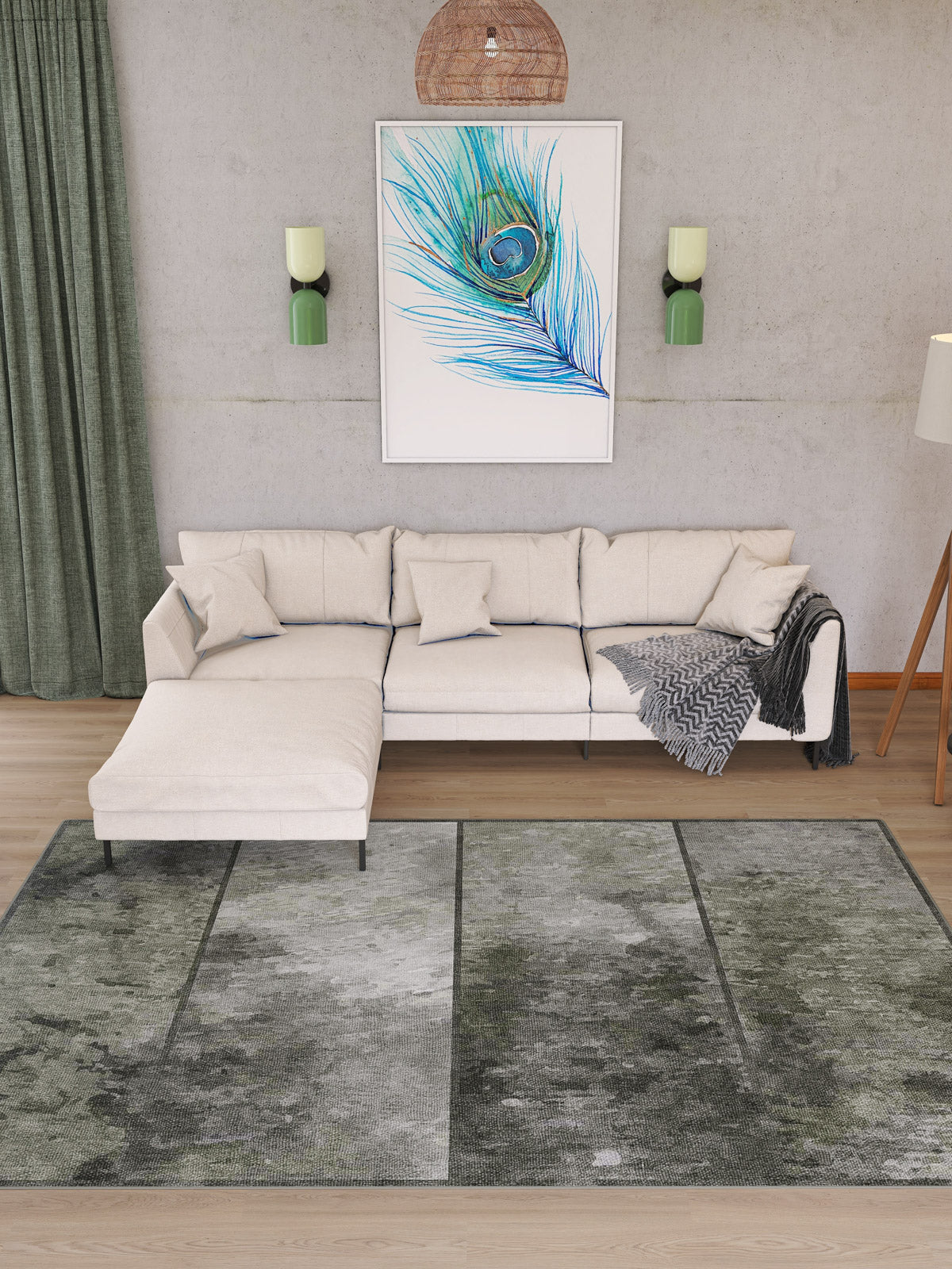 A modern living room featuring a light beige sectional sofa, green curtains, two wall sconces, a cozy throw blanket, a framed peacock feather print, and the Wistful Pattern - Washable Rug - JRN35 (Custom Size) in greenish-gray patterns.