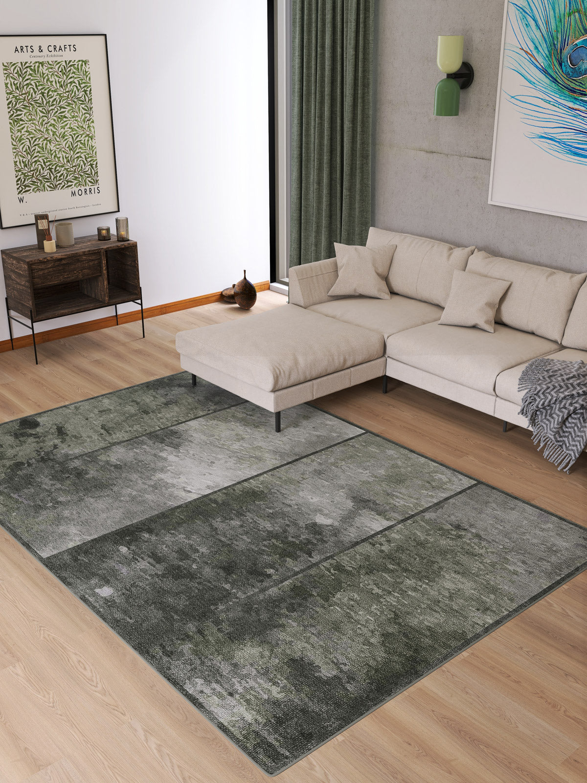 A modern living room with a light sectional sofa, neutral cushions, the Wistful Pattern - Washable Rug - JRN35 (Custom Size) in gray and green, a wooden console table, green curtains, and framed artwork on the walls.