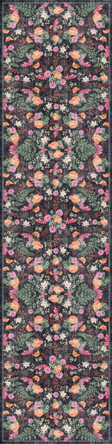The Woven Grace - Washable Rug - JRN28 features a vibrant, symmetrical floral pattern in pink, orange, yellow, and green on a dark background—combining stylish design with durability in a long, narrow flat weave.