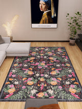 A modern living room with the Woven Grace - Washable Rug - JRN28 (Custom Size), a gray sectional, a potted plant, and a framed Girl with a Pearl Earring print above the sofa. Light wood floors and simple decor complete the look.