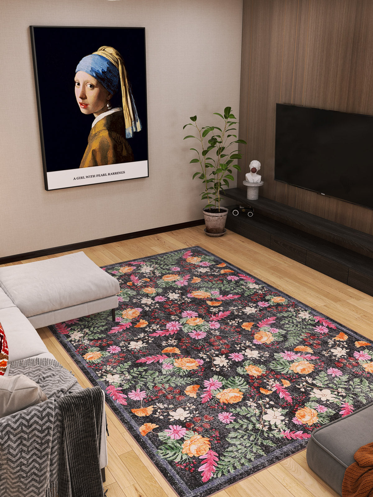 A modern living room with the Woven Grace - Washable Rug - JRN28 (Custom Size), a white sofa, potted plant, flatscreen TV, and framed Girl with a Pearl Earring print. Warm wood tones and soft lighting create an inviting vibe.