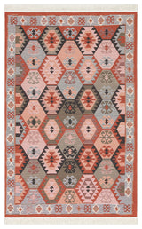 The Woven Spirit - Washable Double-Sided Kilims - AR42 features a rectangular, reversible design with geometric hexagon and diamond patterns in red, pink, gray, and beige—made from recycled cotton with fringed edges and a repeating border motif.