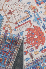 A close-up of the Yonder Blue Cream Washable Rug (LCC3045) shows its red, blue, orange, and cream patterns. One corner folds to reveal a dark non-slip backing—ideal for high-traffic spaces and easy care as a washable rug.
