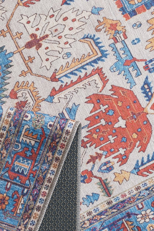 Load image 1 in gallery view. The Yonder Blue Cream Washable Rug - LCC3045 (Custom Size) features vibrant red, blue, gold, and white patterns with a dark, textured non-slip backing—ideal for high-traffic areas and easy to clean.