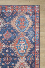 The Zephyro Kilim-Design Washable Rug - LCC3008 features a colorful geometric pattern in red, blue, teal, and cream on a light background. Its diamond shapes and detailed border make it ideal for high-traffic areas.
