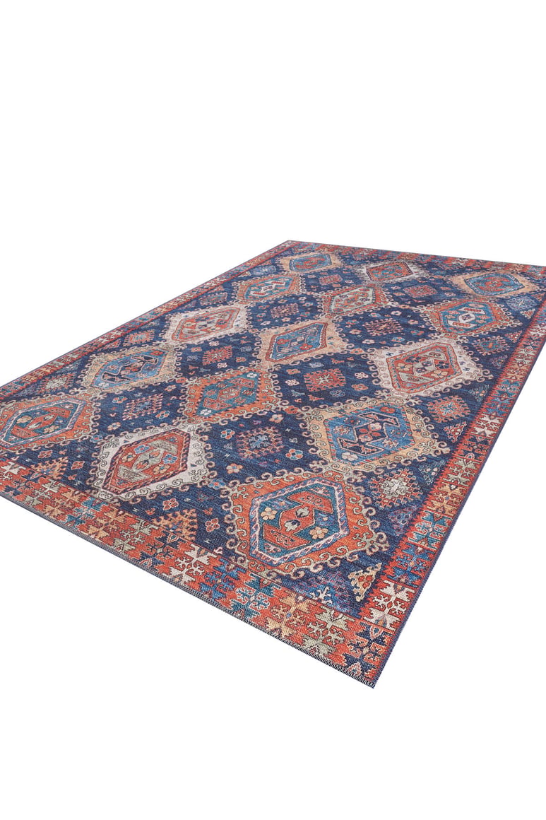 The Zephyro Kilim-Design Washable Rug (LCC3008) showcases blue, orange, red, and cream hexagons and diamonds on a white backdrop—ideal for high-traffic spaces.