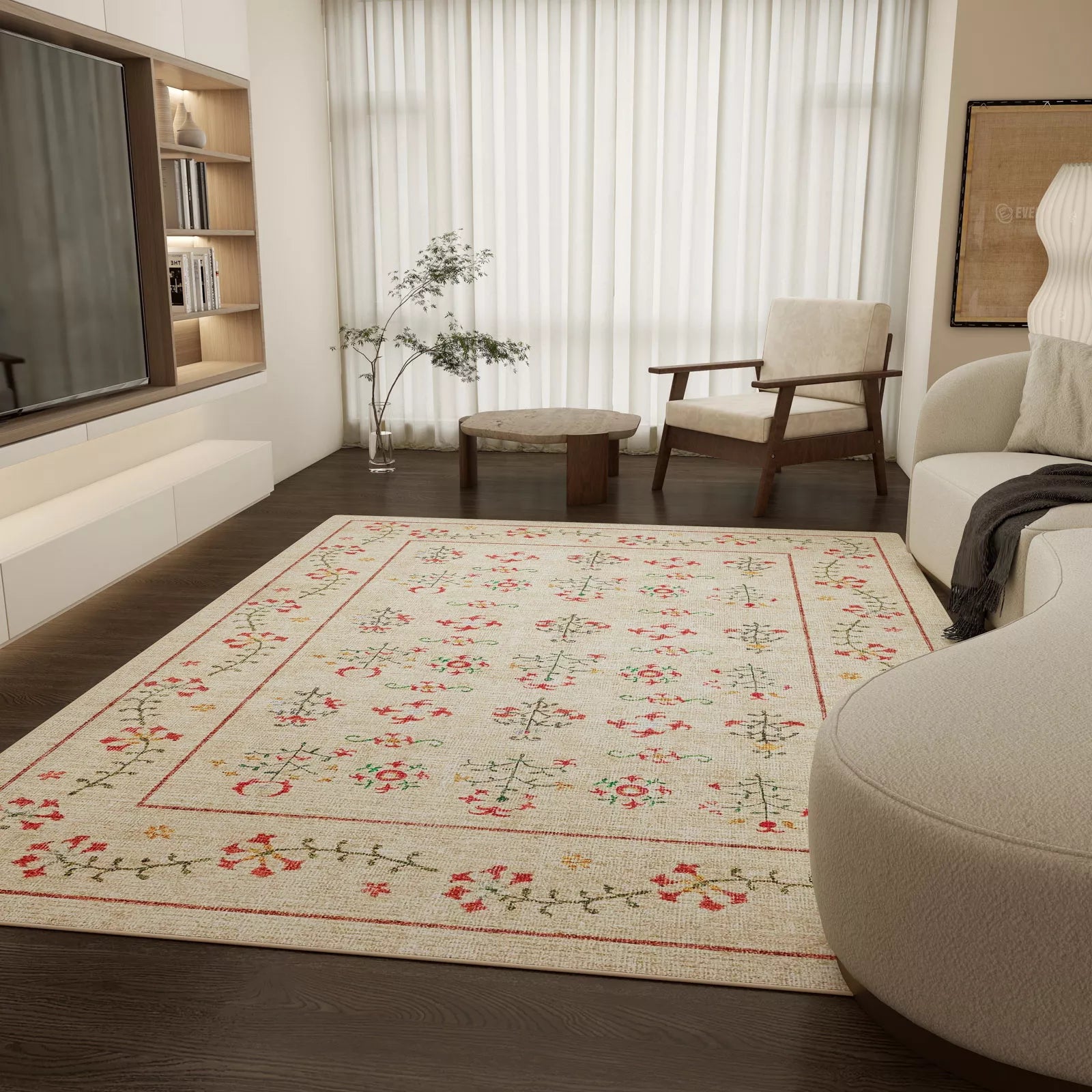 Living room with a floral patterned rug, sofa, and armchair.