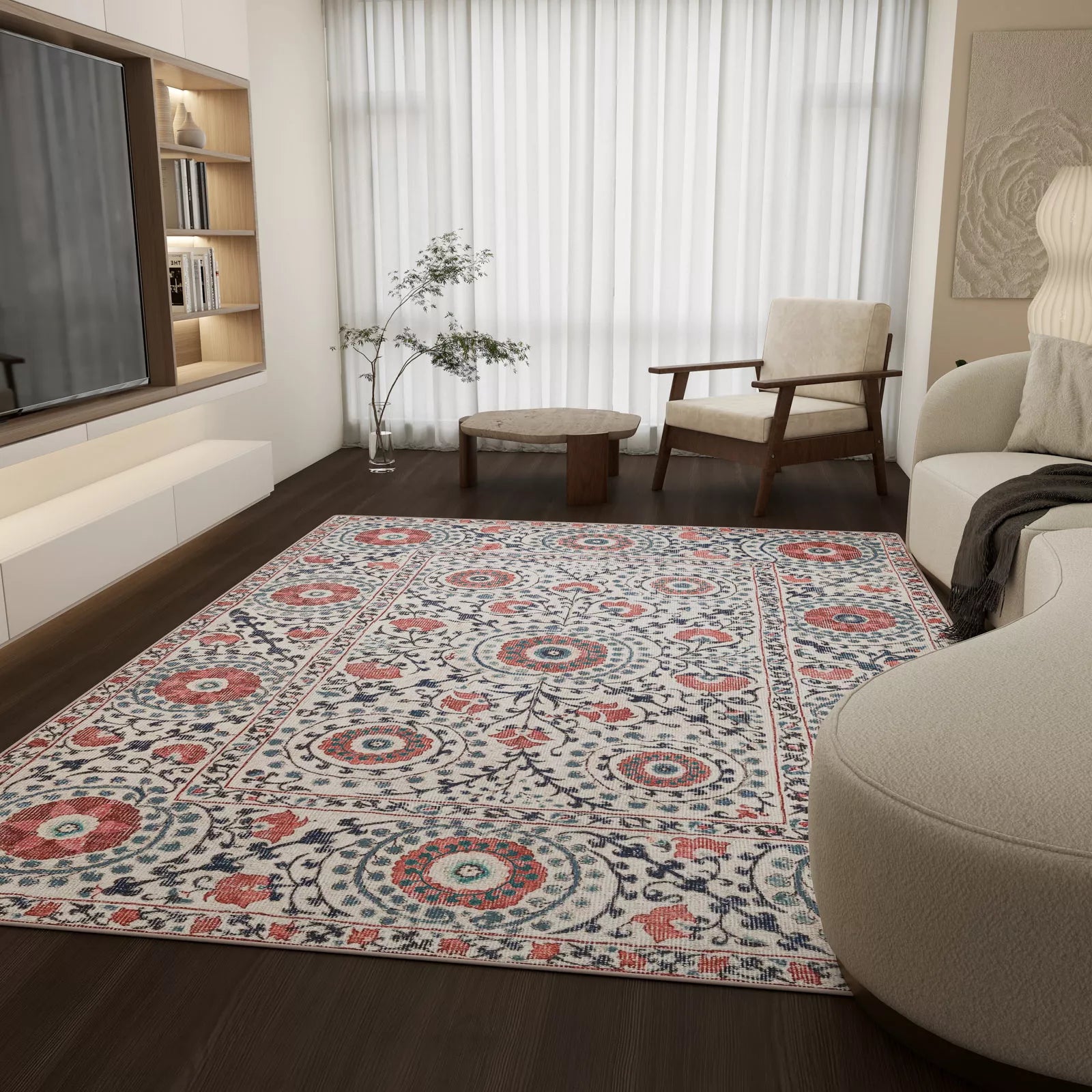 Living room with a patterned rug, sofa, and armchair.