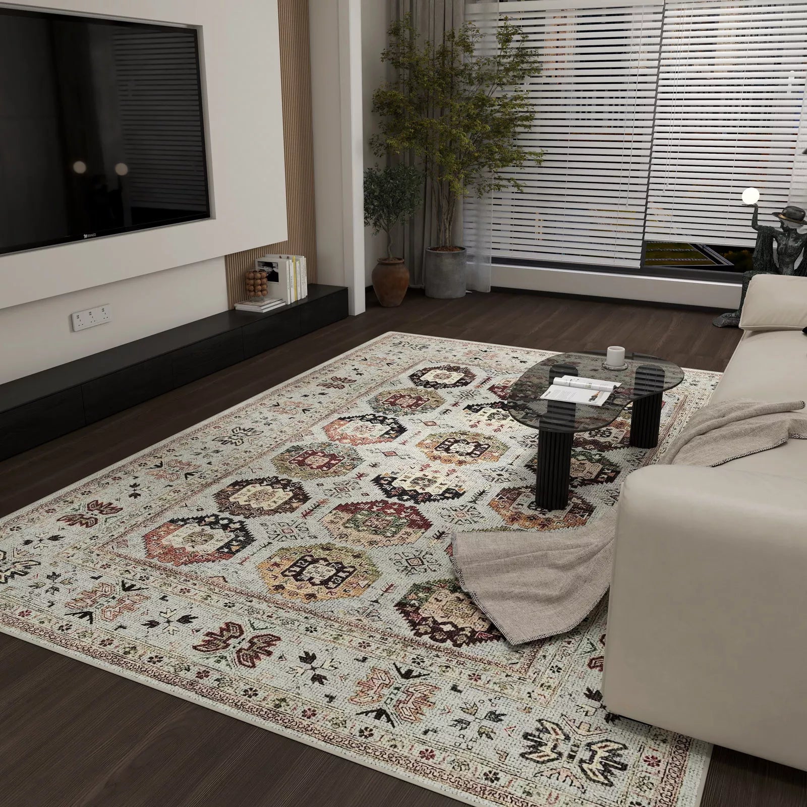 Living room with a patterned rug, sofa, and coffee table.