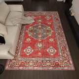 Decorative red rug with intricate patterns in a living room setting.