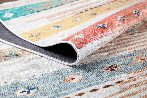 Load image 1 in gallery view. A close-up of the Nomad's Nostalgia - Washable Rug - JR1669 (Custom Size) featuring red, yellow, and teal stripes with geometric patterns; partially folded to reveal its texture—ideal for high-traffic areas.