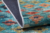 A close-up of the Aztec Ambience - Washable Rug (JR1086) displays its vibrant multicolor floral pattern, folded edge to show the black non-slip backing and stitched white border—ideal for high-traffic areas.