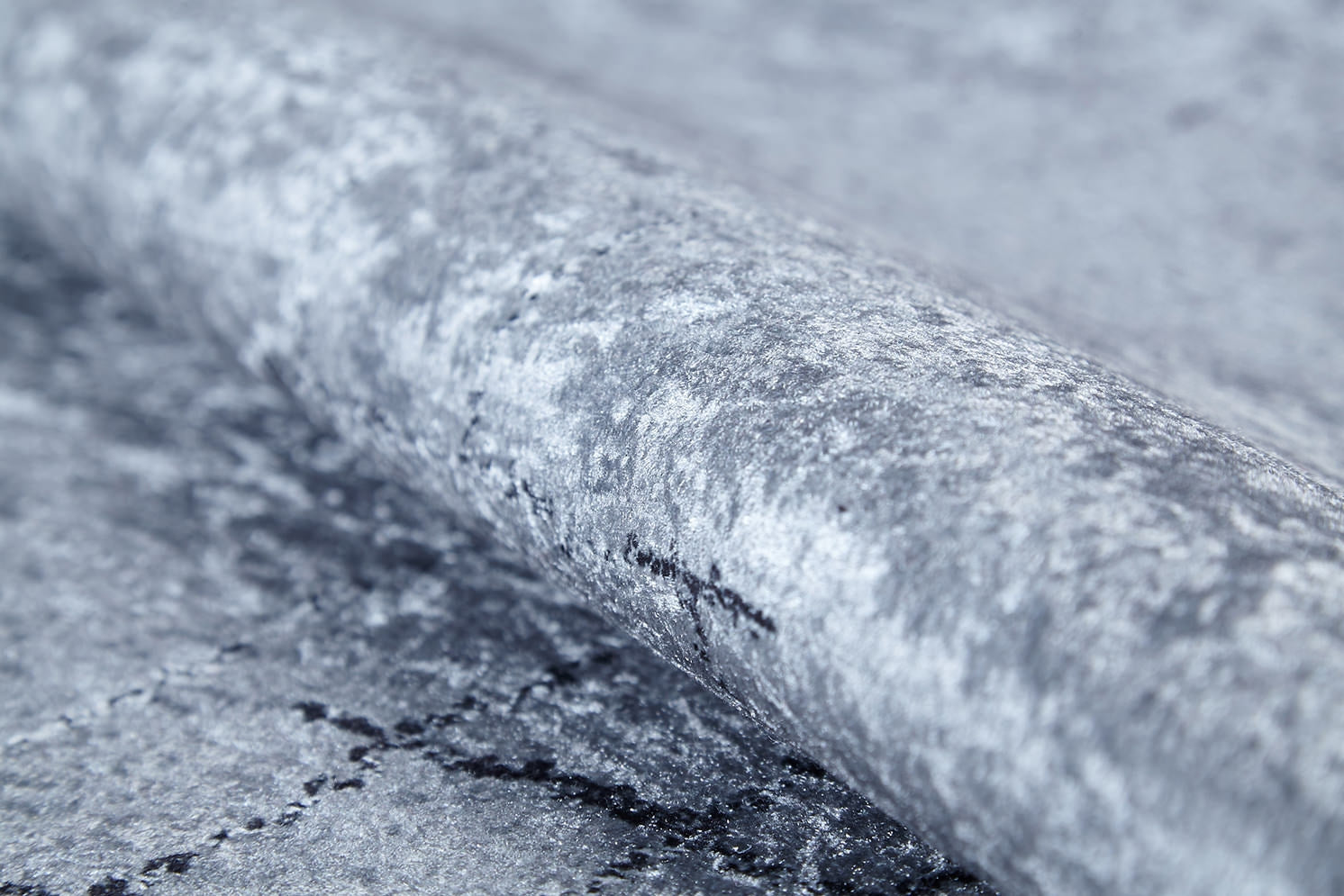 A close-up of the Bohemian Driftwood - Washable Rug (JR1951) in gray-anthracite, featuring a marbled, stone-like pattern with subtle cracks—perfect for high-traffic areas.