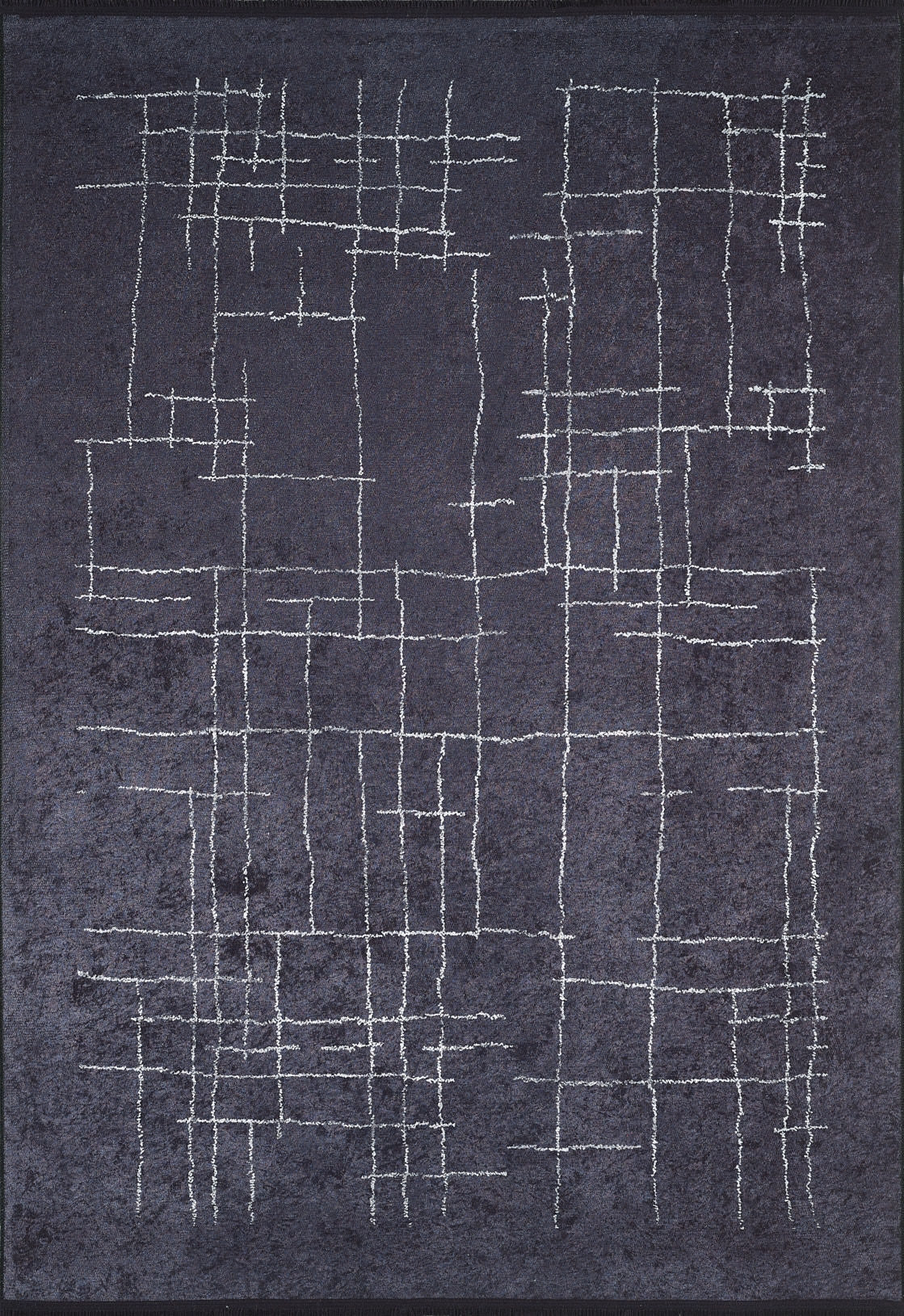 The Bohemian Illusion - Washable Rug - JR1953 is a dark, textured flat weave black rug with an abstract grid of uneven white lines, creating an irregular geometric design across its washable surface.