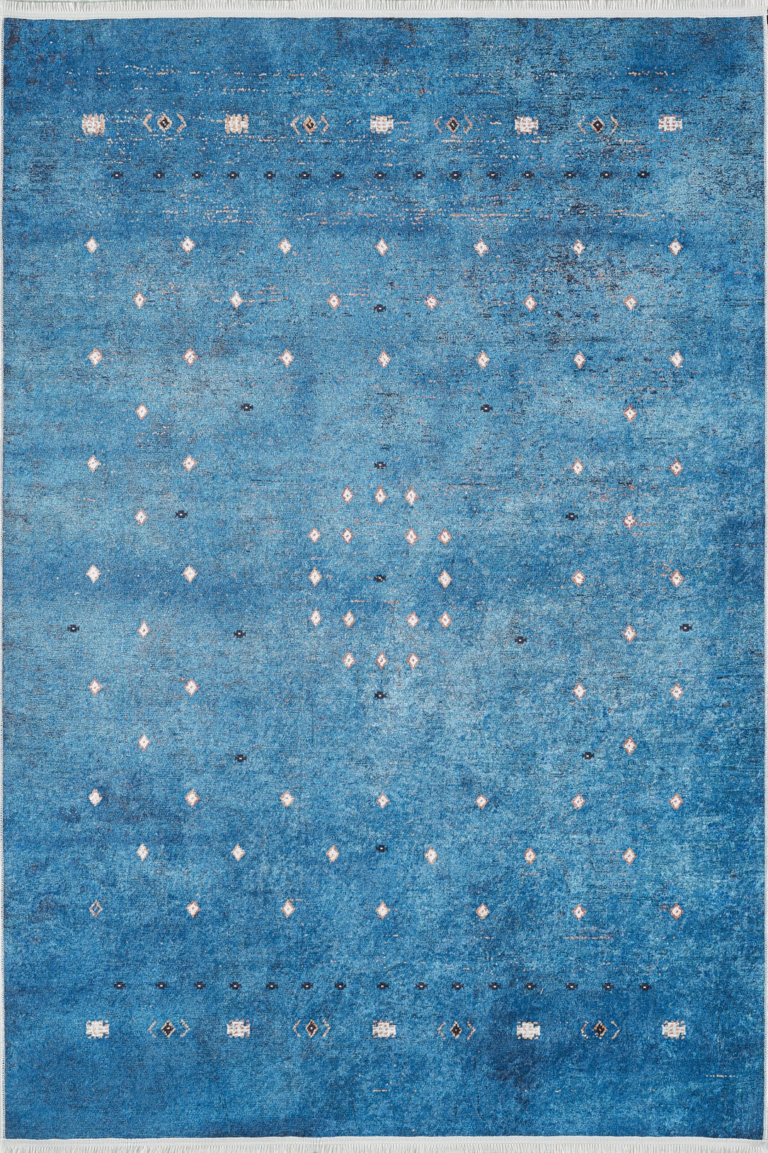 The Bohemian Whirlwind - Washable Rug (JR1989) features blue gradient tones with white and black diamond motifs in rows and a central circle, making it a stylish, practical choice for high-traffic areas.