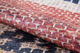 Close-up of the Boho Bliss - Washable Rug - JR1723 shows its textured flat weave and geometric pattern in red, cream, and beige tones—highlighting the intricate design and raised surface for stylish, easy-care decor.