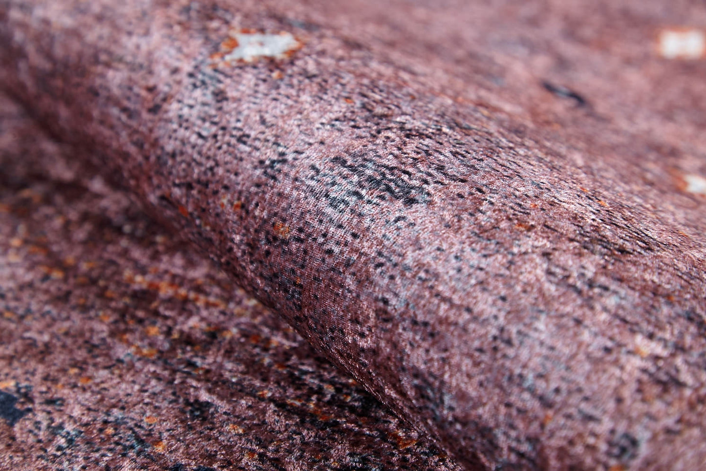A close-up of Boho Magic - Washable Rug - JR1993 shows its brownish-pink, speckled texture—resembling stone or rough paper—ideal for allergy-sensitive spaces that want the look of bronze and brown rugs.