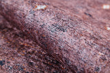 A close-up of Boho Magic - Washable Rug - JR1993 shows its brownish-pink, speckled texture—resembling stone or rough paper—ideal for allergy-sensitive spaces that want the look of bronze and brown rugs.
