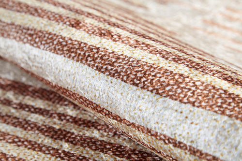 Load image 1 in gallery view. A close-up of the Boho Paradise - Washable Rug - JR2004 showcases its textured flat weave with horizontal brown and beige stripes, a speckled pattern, and intricate detailing in the soft folds of the fabric.