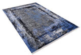 The Bold and Minimalist - Washable Rug - JR1229, with an abstract blue, black, gray, and white design, is shown angled on a white background—perfect for high-traffic areas.