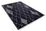 The Byzantine Beauty - Washable Rug (JR1037) is a rectangular black rug with an abstract white crisscross and diamond design, ideal for high-traffic areas. Shown angled against a white background.