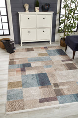 The Classic Check - Washable Rug - JR1955, featuring a beige and blue geometric square pattern, is displayed on a light wood floor before a white cabinet with decor and a potted plant—perfect for high-traffic areas.