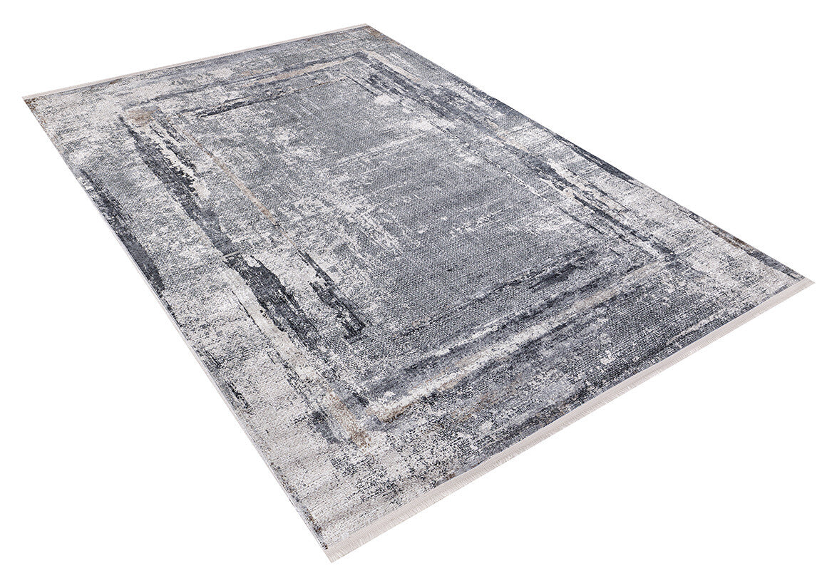 The Classic and Bold - Washable Rug - JR1529 is a rectangular gray-anthracite rug with a distressed abstract pattern in gray, black, and white, plus a subtle border. Ideal for high-traffic areas, it's shown on a white background.