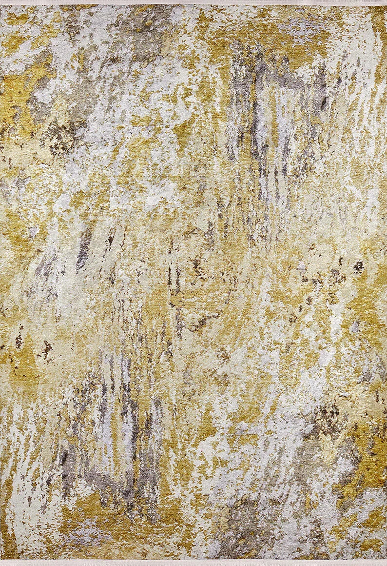 The Color Splash - Washable Rug - JR146 features an abstract textured surface in gold, cream, and silver with a rough metallic finish—perfect for high-traffic areas thanks to its dynamic streaks, shimmering accents, and easy-care durability.