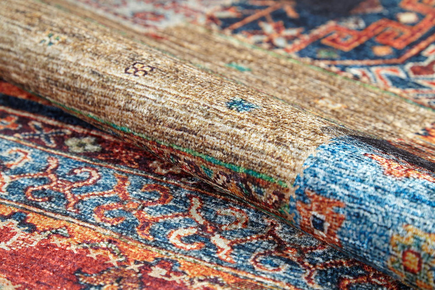 A close-up of the Colorful Composition - Washable Rug - JR5107 showcases its intricate multicolor designs in blue, red, orange, and beige, with the flat weave's texture clearly visible.