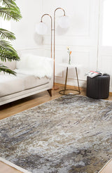 A modern living room features a light sofa, white faux fur throw, gold globe floor lamp, round table with books and flowers, black ottoman, leafy plant, and the Contemporary Canvas - Washable Rug - JR145—perfect for high-traffic areas.