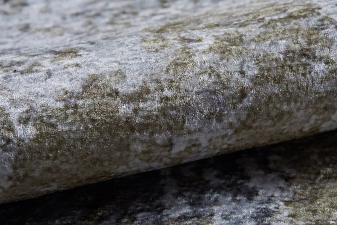 Close-up of Contemporary Canvas - Washable Rug - JR145, featuring folded, textured mottled velvet in gray and olive green tones—soft, plush, and durable for high-traffic spaces.