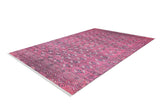 The Desert Dreamscape - Washable Rug - JR1940 is a rectangular, soft pink rug with geometric and floral patterns, shown angled on a white background. It features white fringe on the short edges and combines style with easy, everyday practicality.