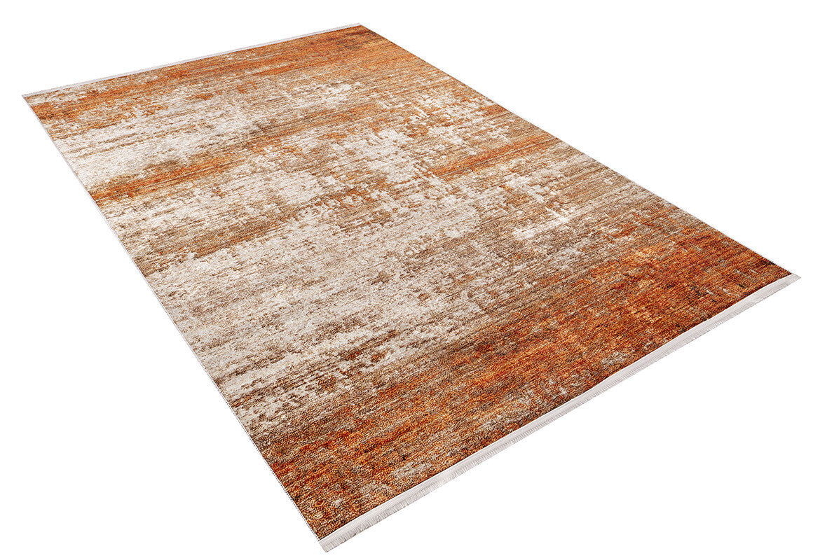 The Fluffy Brushed - Washable Rug - JR584 is a rectangular orange flat weave rug with abstract patterns in brown, orange, and beige. It features a textured look with visible fibers and is shown on a white background.