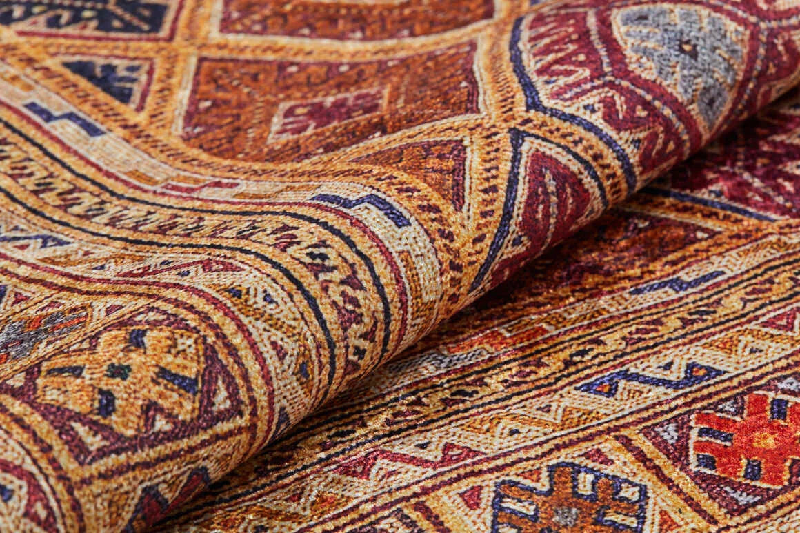 A close-up of the Grandiose Grace - Washable Rug - JR44, featuring intricate geometric patterns in red, yellow, blue, and brown. Its detailed texture and washable design make it ideal for high-traffic areas.