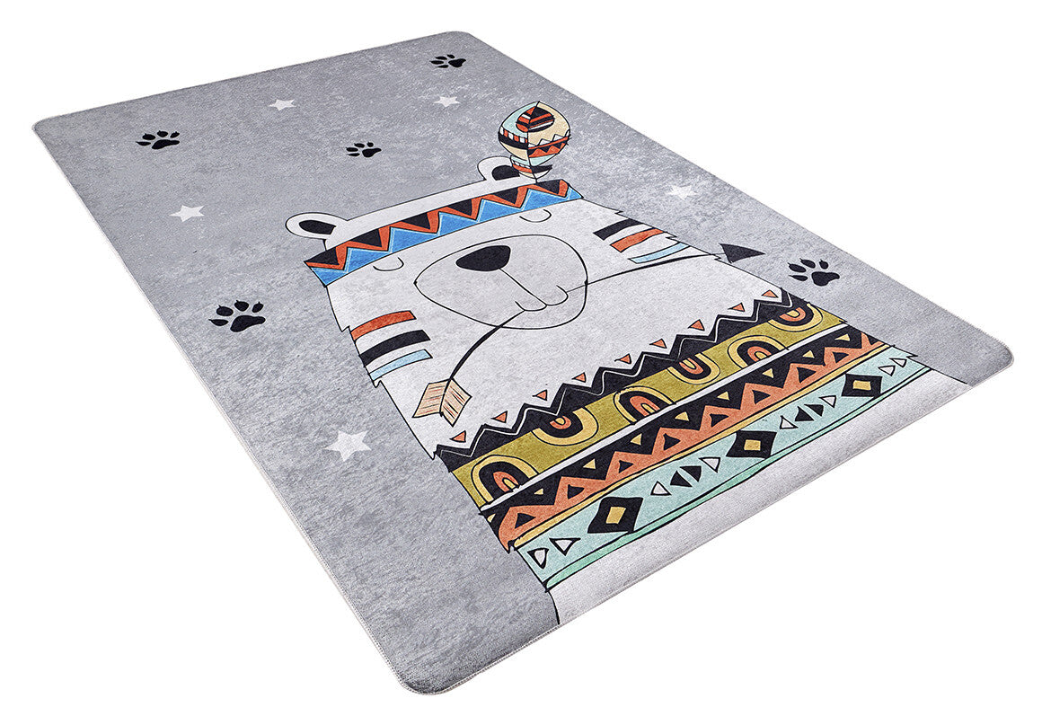 The Groovy Bear - Machine-Washable Rug JRC093 is a rectangular gray-anthracite rug with a cartoon bear in colorful tribal patterns, a feather headband, and arrow, plus white stars and black paw prints—ideal for high-traffic areas.
