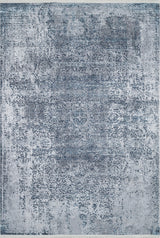 The Imperial Lace - Washable Rug - JR1607 is a rectangular rug with a distressed vintage blue and gray pattern, featuring faded ornate designs and a weathered look—ideal for high-traffic areas.