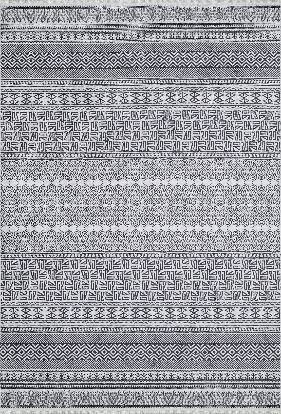 The Indie Impressions - Washable Rug - JR1648 features black and white geometric patterns with chevrons, diamonds, swirls, and maze-like motifs in horizontal rows. Its durable design makes it perfect for high-traffic areas.