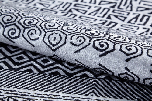 Load image 1 in gallery view. The Indie Impressions - Washable Rug - JR1648 features black geometric and spiral designs on a light gray background, offering bold style that's easy to maintain—perfect for high-traffic areas.