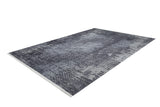 The Infinity Garden - Washable Rug - JR1749 is a rectangular, distressed rug in gray and black tones, featuring a textured pattern. It's washable and perfect for high-traffic spaces, shown here on a white background.