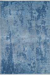The Ivory Whisper - Washable Rug - JR1628 features a rectangular blue design with abstract blue and light gray patterns, resembling brushstrokes, ideal for high-traffic areas.