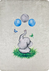The Joyful Elephant - Machine-Washable Rug JRC026 features a cute cartoon elephant on grass with balloons and butterflies, set against a light background. Durable, allergy-friendly, and perfect for kids’ rooms.