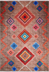 The Kilim Kingdom - Washable Rug - JR1536 features vibrant red, orange, blue, and white geometric diamond patterns on a brown base with side zigzags, bringing bold energy and style to any room.