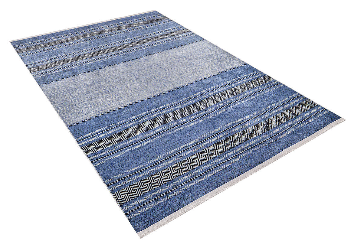The Layered Lines - Washable Rug - JR1545 is a rectangular blue rug with horizontal blue and gray stripes and geometric patterns, ideal for high-traffic areas and shown on a white background.
