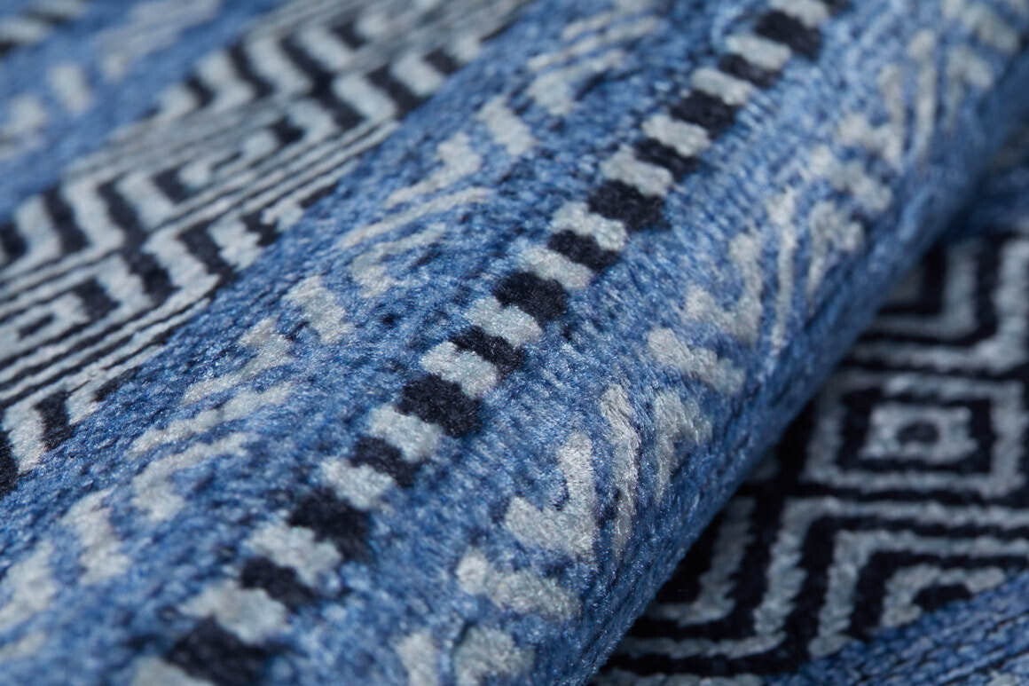 Close-up of the Layered Lines - Washable Rug (JR1545) in blue and white, featuring intricate geometric and zigzag patterns—highlighting its texture and durable weave, perfect for high-traffic areas.