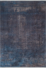 The Luxurious Fleur - Washable Rug - JR1897 is a large blue rug with a textured, distressed pattern and faded geometric and floral designs—ideal for high-traffic areas and easy to maintain thanks to its washable feature.