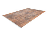 The Modern Mosaic - Machine-Washable Rug JR1846 is a large rectangular orange rug with a distressed, textured design in orange, brown, and beige. It features short fringes on the ends and is ideal for high-traffic areas. Shown on a white background.