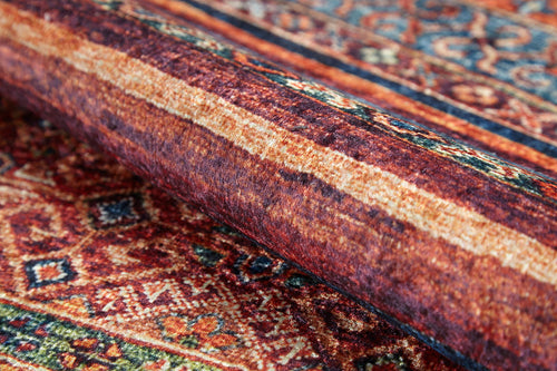 Load image 1 in gallery view. A close-up of the Native Nightscape - Washable Rug (JR5093), featuring intricate geometric designs in red, orange, blue, and beige—perfect for high-traffic areas.