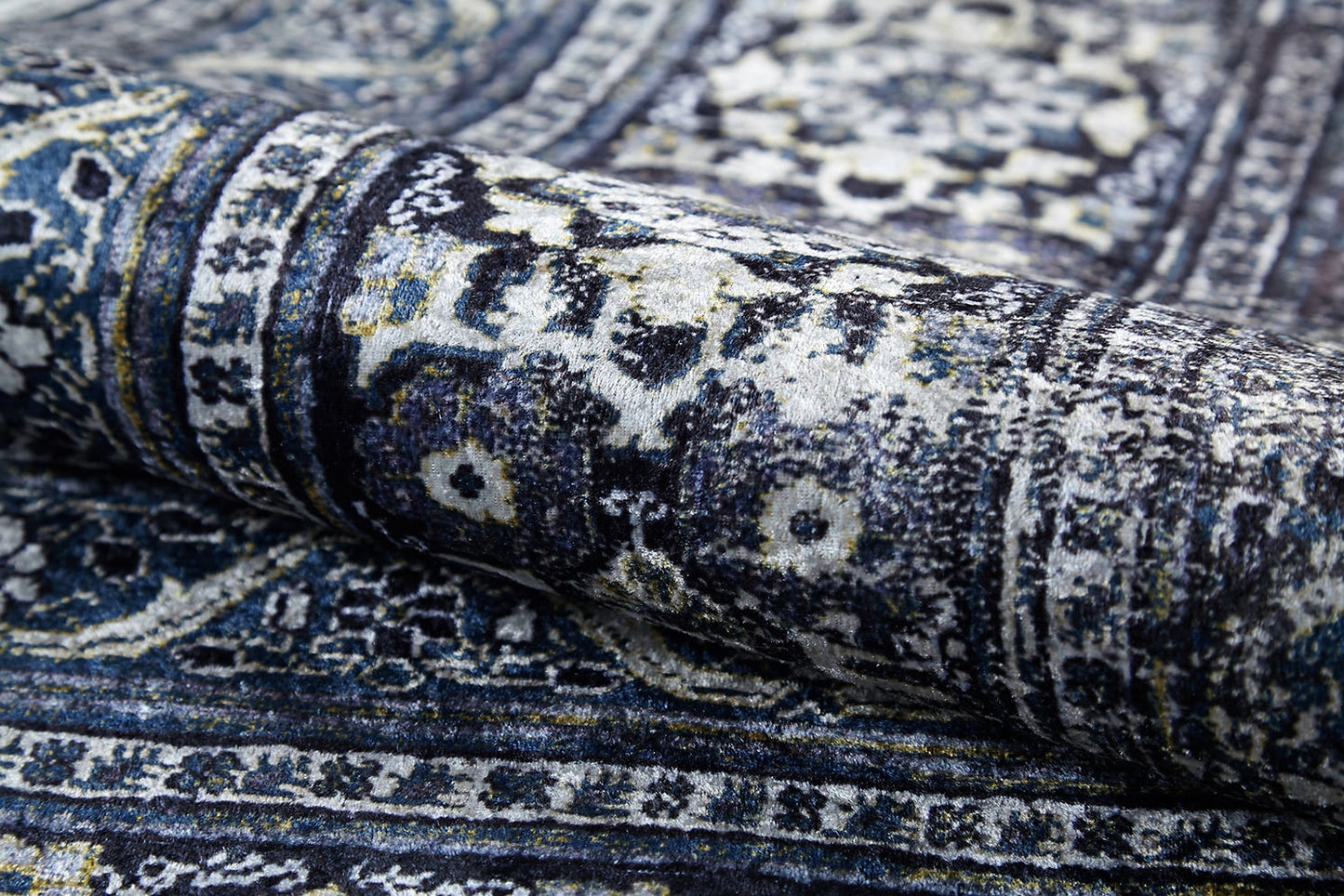 A close-up of the Opulent Beauty - Washable Rug - JR1932 reveals its ornate blue and white floral and geometric patterns—durable and perfect for high-traffic areas.